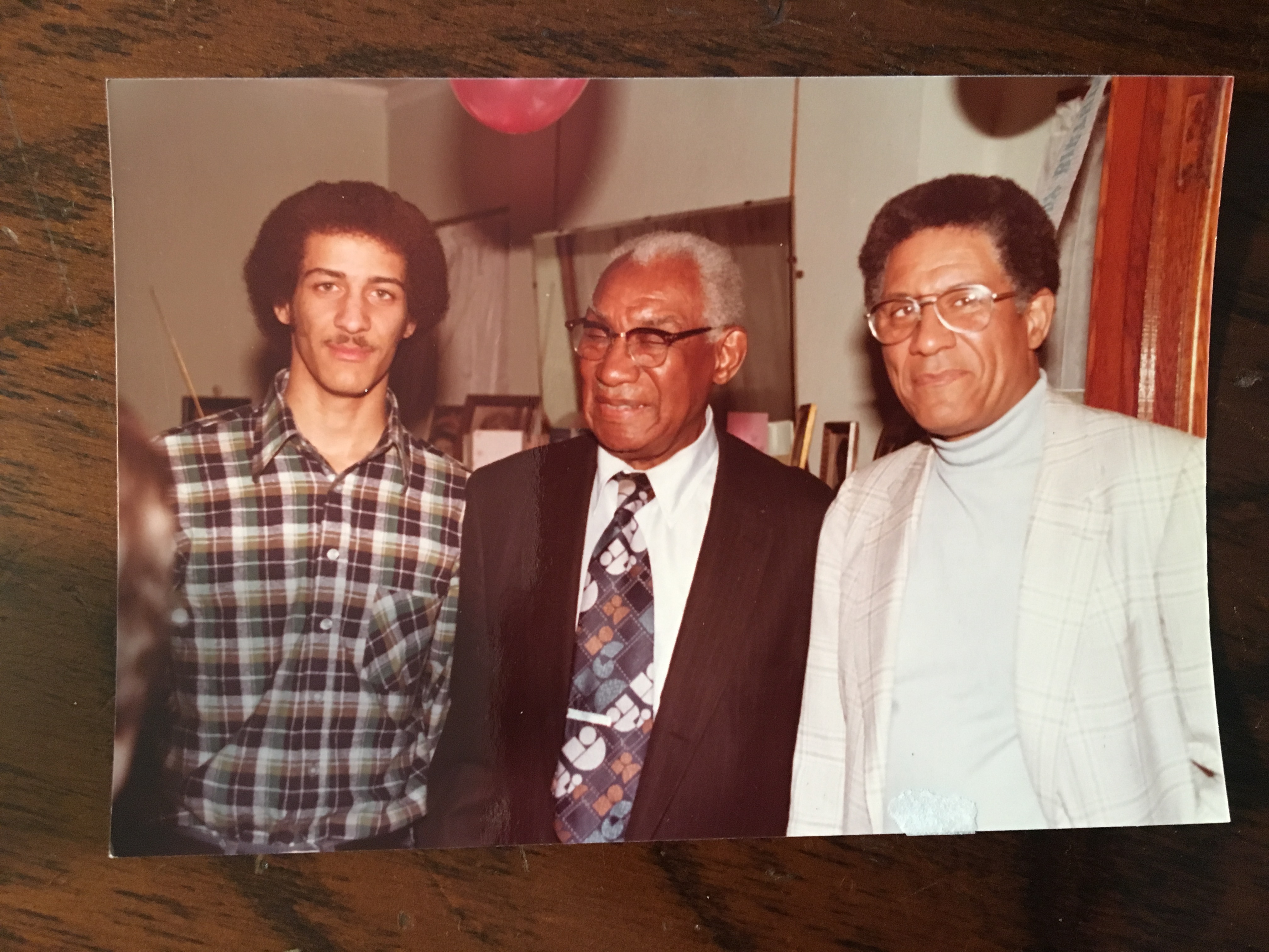 Grandson Eric Jefferson, left, a future Ford employee, John Lee, center, and son Horace Jefferson.